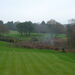 <Looking back from the green to the previously hidden tee